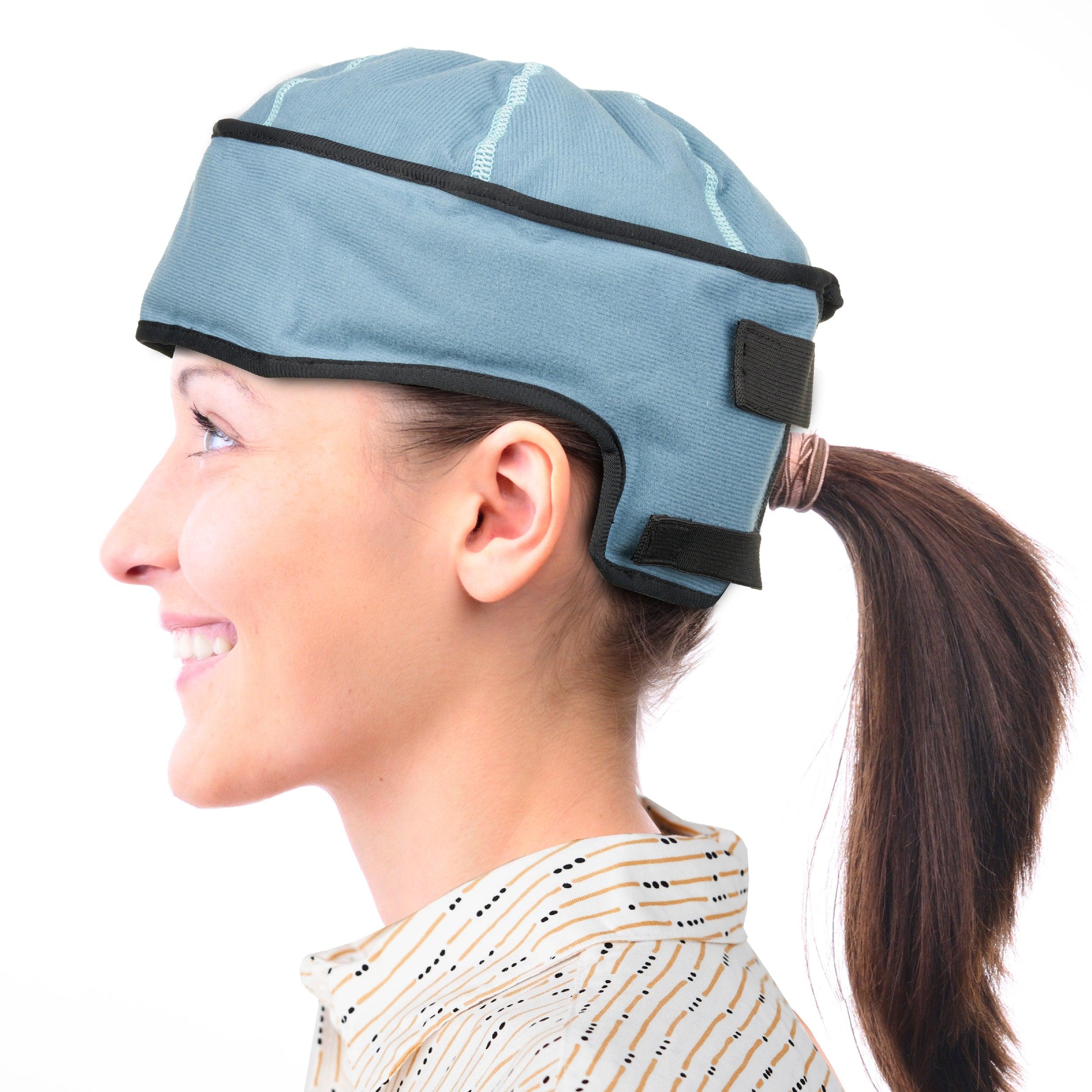 A person wearing the NatraCure Advanced Cold Therapy Cap, showcasing its snug fit and sleek design.